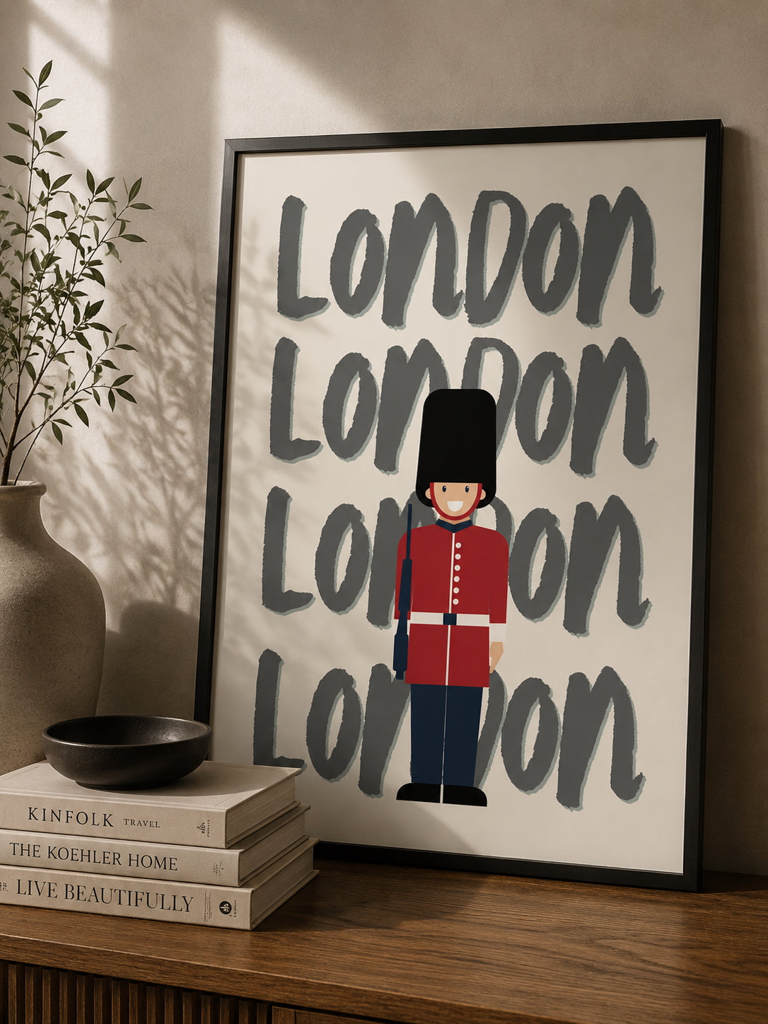 London Travel Poster displayed in a modern desk.