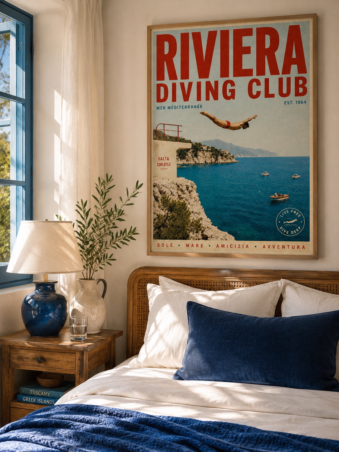Riviera Diving Club Travel Poster displayed in a warm Mediterranean-inspired bedroom with deep blue accents