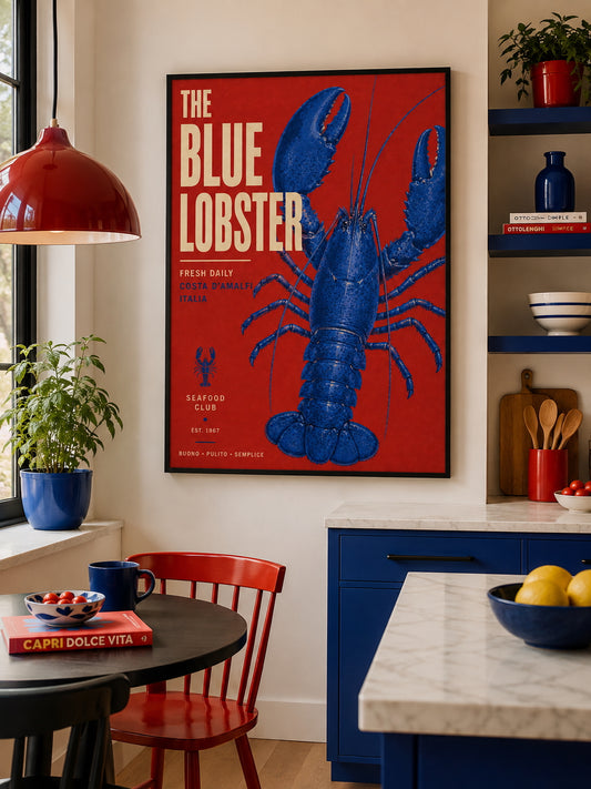 The Blue Lobster Poster displayed in a colourful contemporary kitchen with bold red and blue accents
